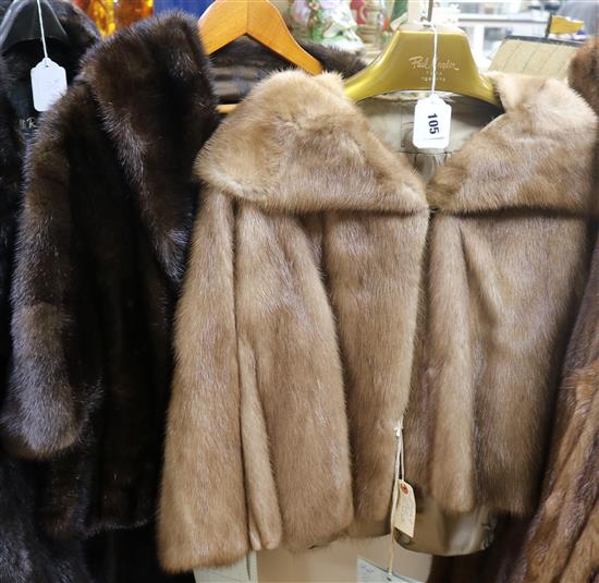 A blonde mink jacket and a dark brown mink jacket